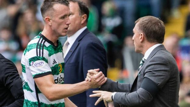 David Turnbull is greeted by Celtic manager   Brendan Rodgers aft  coming off