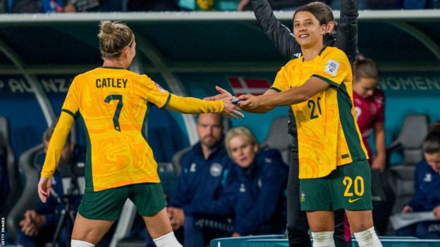 Sam Kerr is given the captain's armband by Steph Catley during Australia's win over Denmark