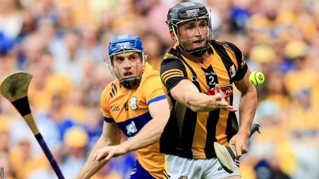 Kilkenny's Mikey Butler (right) gets out in front of Clare's Shane O'Donnell