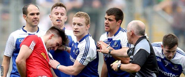 Tyrone's Tiernan McCann is jostled by Monaghan players in the closing stages of Saturday's All-Ireland quarter-final