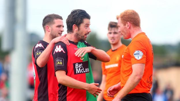 Glentoran striker Curtis Allen was booked following a confrontation with Carrick's Joe McNeill late in the game at Taylor's Avenue