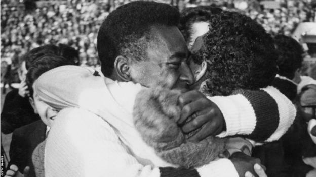 Pele embraces a team-mate after Brazil win the World Cup in 1962