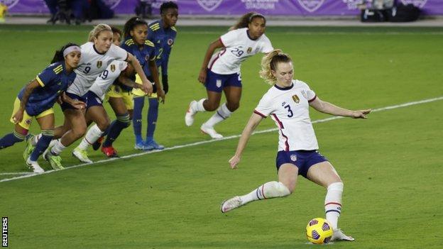 Sam Mewis scores a penalty for the United States against Colombia