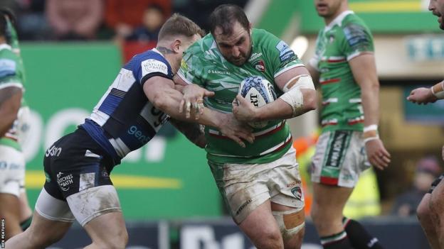 Prop James Cronin (right) holds the ball in a tackle for Leicester