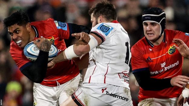 Munster centre Malakai Fekitoa attempts to brush off Ulster's Stuart McCloskey