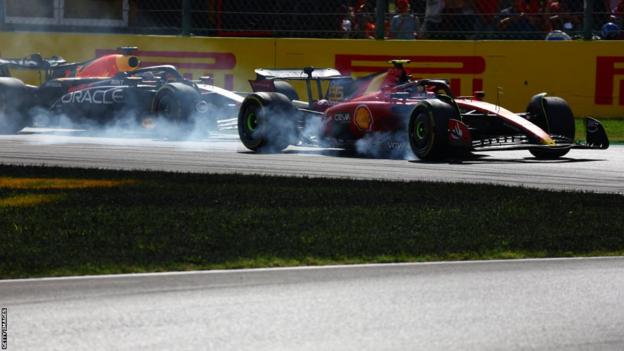 Ferrari's Carlos Sainz locks up as he defends from Max Verstappen