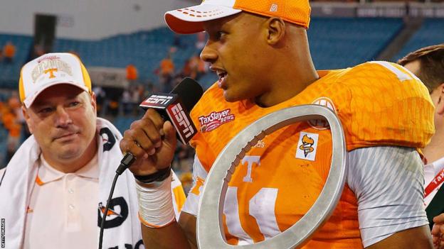 Joshua Dobbs with the MVP trophy after Tennessee won the TaxSlayer Bowl in 2015