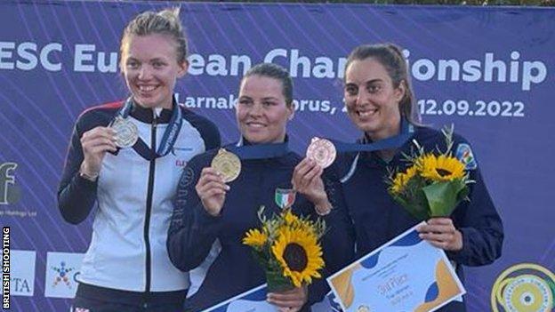 Lucy Hall (left) on the medal podium