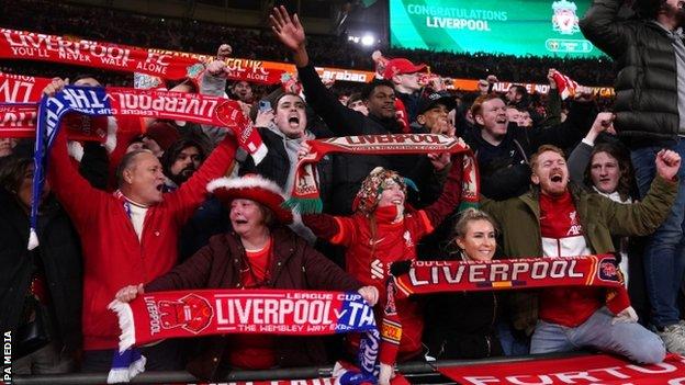 Liverpool fans celebrate after their team wins the Carabao Cup at Wembley in 2022