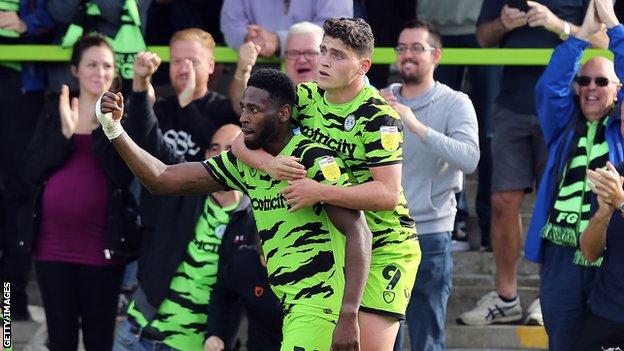 Jamille Matt and Matty Stevens celebrate scoring against Northampton in League Two