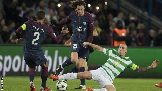 Celtic captain Scott Brown (right) tackles PSG's Edinson Cavani