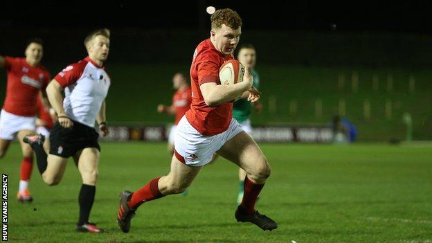 Aneurin Owen runs in to score a try