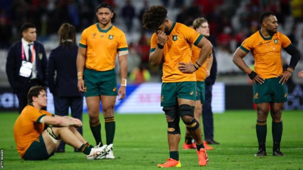 Australia players look dejected after losing to Wales