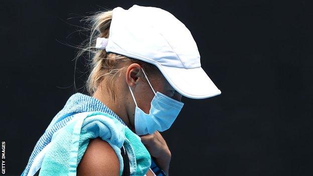 Yulia Putintseva of Kazakhstan walks off the court wearing a face mask following defeat in her Women's Singles third round match against Elina Svitolina of Ukraine during day six of the 2021 Australian Open at Melbourne Park