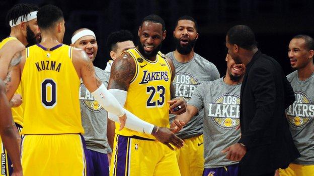 LeBron James surrounded by LA Lakers team-mates