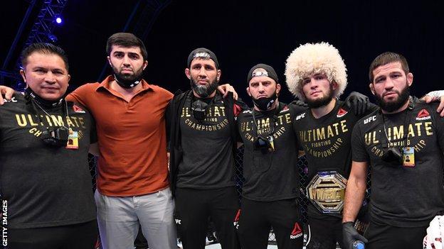 Khabib Nurmagomedov (second right) with his team