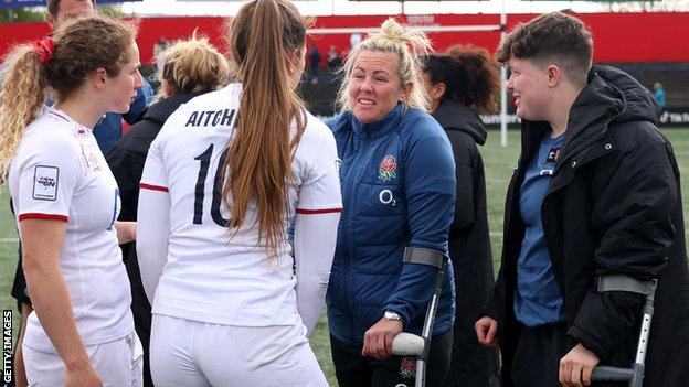 Marlie Packer and Hannah Botterman with crutches after England's win over Ireland