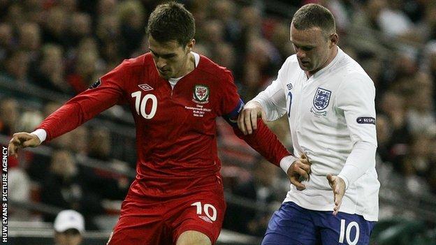 Aaron Ramsey and England's Wayne Rooney