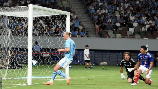 Manchester City's Erling Haaland scores during pre-season against Yokohama F Marinos
