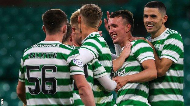 Celtic players celebrate David Turnbull's second goal