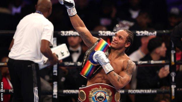Anthony Yarde celebrates victory with his belts