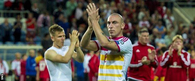 Scott Brown salutes the Scotland fans who travelled to the Algarve to see the team beat Gibraltar 6-0 at the end of the failed bid to reach the Euro 2016 finals