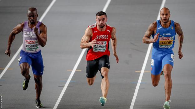 Eugene Amo Dadzi (left) competes against Olympic 100m champion Lamont Marcel Jacobs of Italy (right) at the European Indoor Championships in March