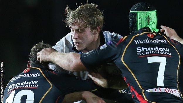Glasgow's Jonny Gray takes on the Dragons' Nick Macleod and Nic Cudd (right)