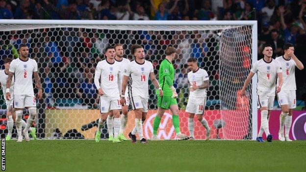 England players look dejected after Italy score in the Euro 2020 final