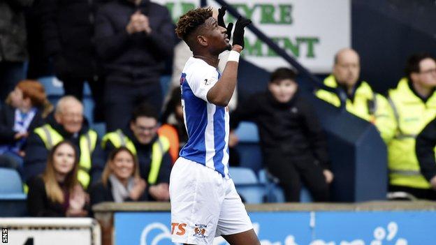 Kilmarnock midfielder Aaron Tshibola celebrates scoring against Brora Rangers