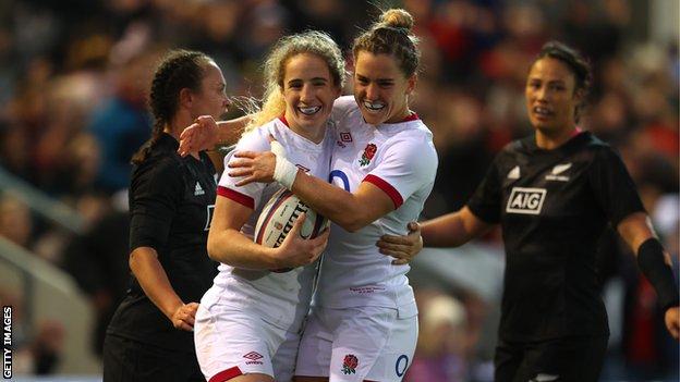 Abby Dow and Leanne Riley celebrate a try