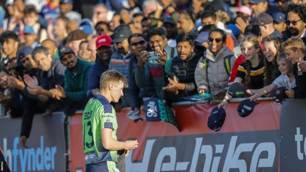 Ireland's Harry Tector signs autographs for the crowd during a sold-out match against India last June.