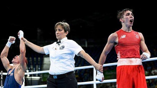 Vladimir Nikitin's arm is lifted by the ref in Rio 2016 quarter-final bout