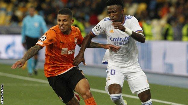 Vinicius Junior challenges for the ball for Real Madrid