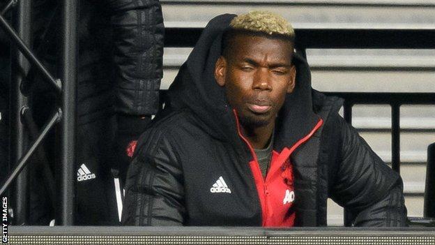Paul Pogba sits on the Manchester United bench