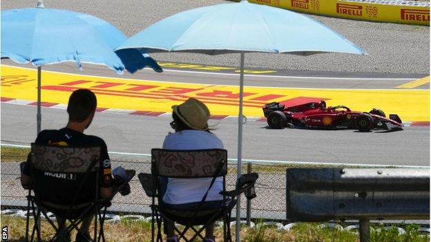 Spectators shelter from the sun at the Spanish Grand Prix