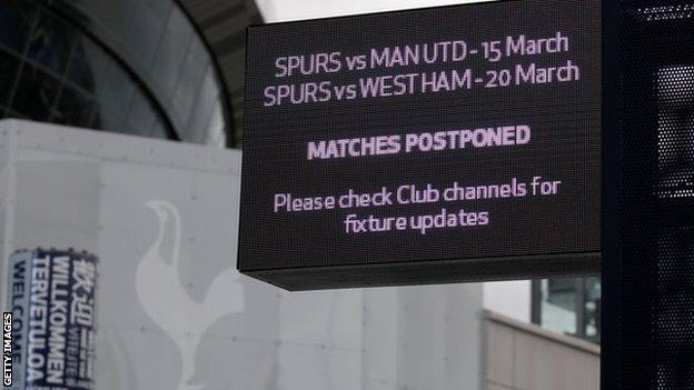 Sign displaying news of matches being postponed