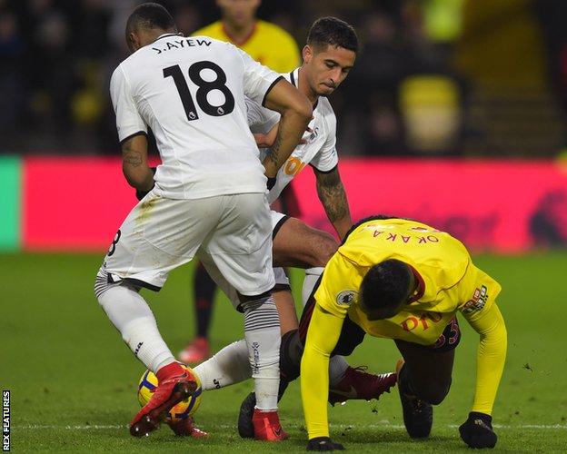 Kyle Naughton appears to stamp on the leg of Watford's Stefano Okaka
