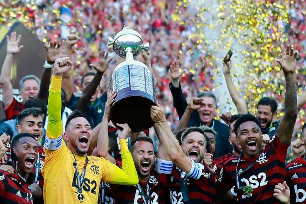 Flamengo players celebrate the 2-1 win over River Plate in Lima on 23 November