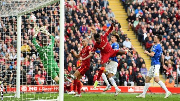 Divock Origi heads in for Liverpool against Everton