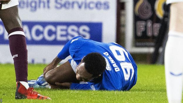Danilo lies injured on the ground