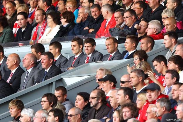 Steven Gerrard (centre) watches on at Anfield