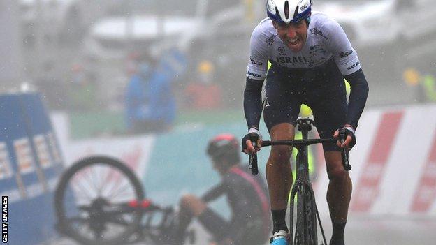 Mike Woods powers to the line with Geraint Thomas on the ground behind him