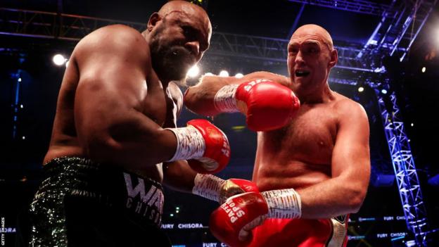Tyson Fury punches Derek Chisora