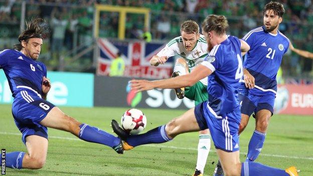 Steven Davis fires through a crowded penalty area in the first half