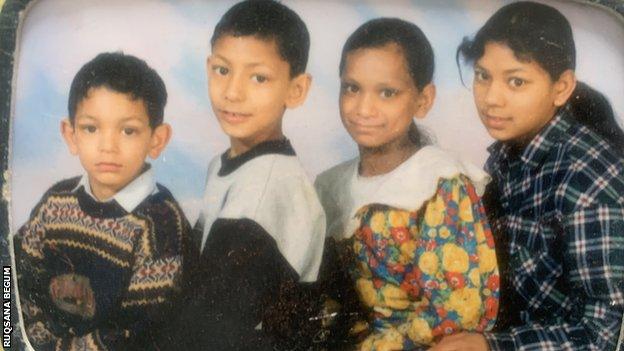 Ruqsana Begum as a child with her sister and two brothers