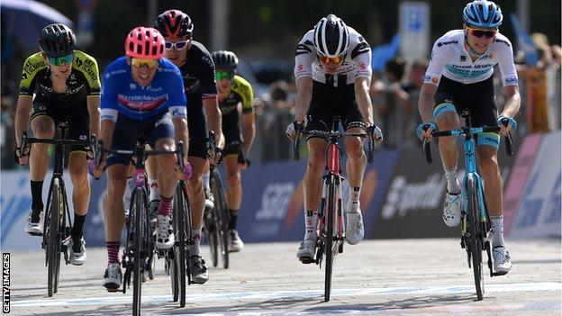 Michael Woods retained the leader's blue jersey by finishing third in Thursday's fourth stage