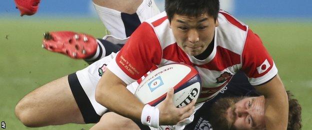 Japan replacement Kosei Ono is tackled by Scotland's Ruaridh Jackson
