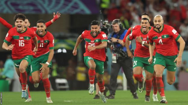 Morocco celebrate their World Cup last-16 win over Spain