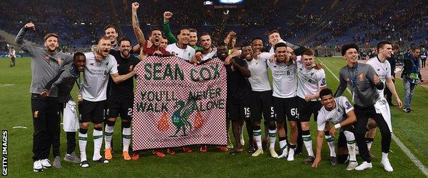 Liverpool players with the Sean Cox banner